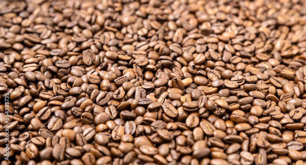Texture of coffee beans photo background, focus on the edges of coffee beans. Texture of coffee beans photo background, focus on the edges of coffee beans.