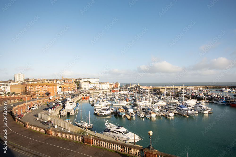 Ramsgate harbor, with boats and blue sky