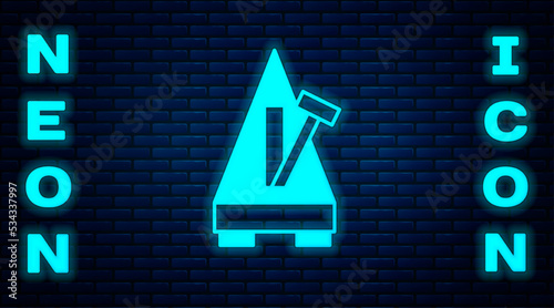 Glowing neon Classic Metronome with pendulum in motion icon isolated on brick wall background. Equipment of music and beat mechanism. Vector