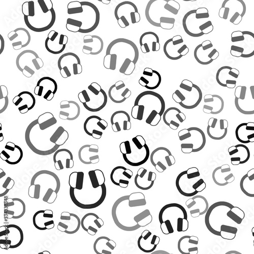 Black Headphones icon isolated seamless pattern on white background. Earphones. Concept for listening to music  service  communication and operator. Vector