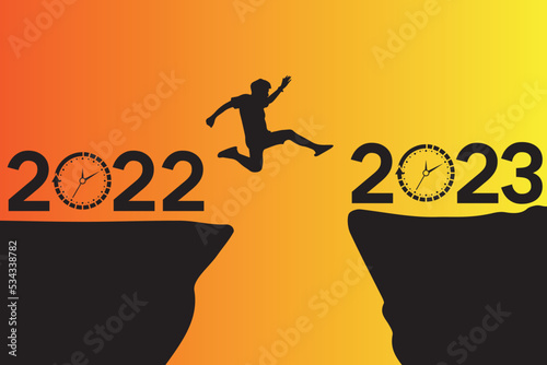 Young Man Jump Between 2022 to 2023. happy new year.