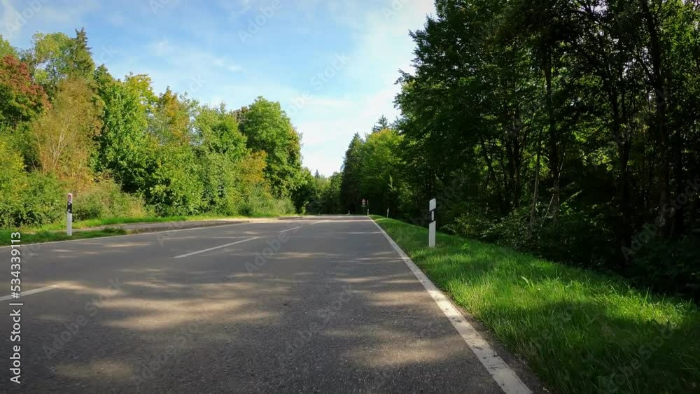 Cyclist taking part in individual time trial. Triathlete riding road bicycle Cyclist taking part in individual time trial. Triathlete riding road bicycle
