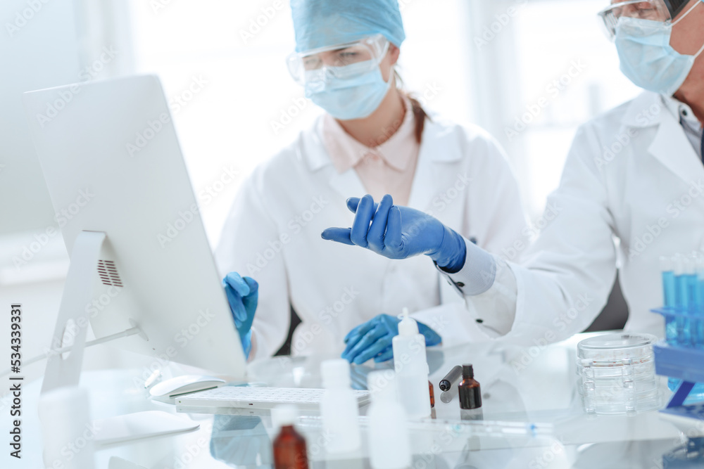 scientists discussing the results of research in a modern laboratory.