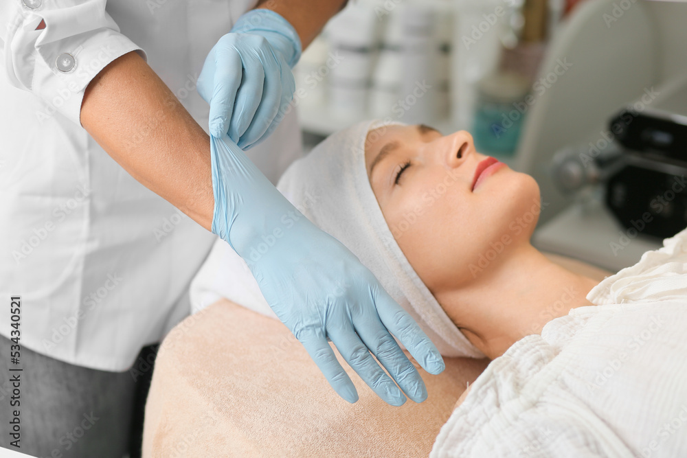 Obraz premium close up of Doctors hands putting on nitrile gloves