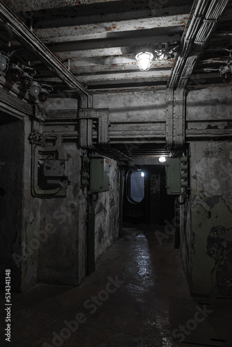 Abstract dark military bunker interior, vertical photo