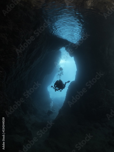 sun beam and rays sun shine underwater in caves and caverns backgrounds scuba divers to explore