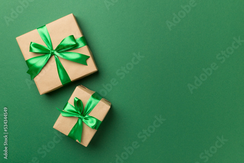 Christmas gift boxes on color background, top view