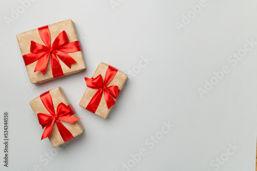 Christmas gift boxes on color background, top view © Liami