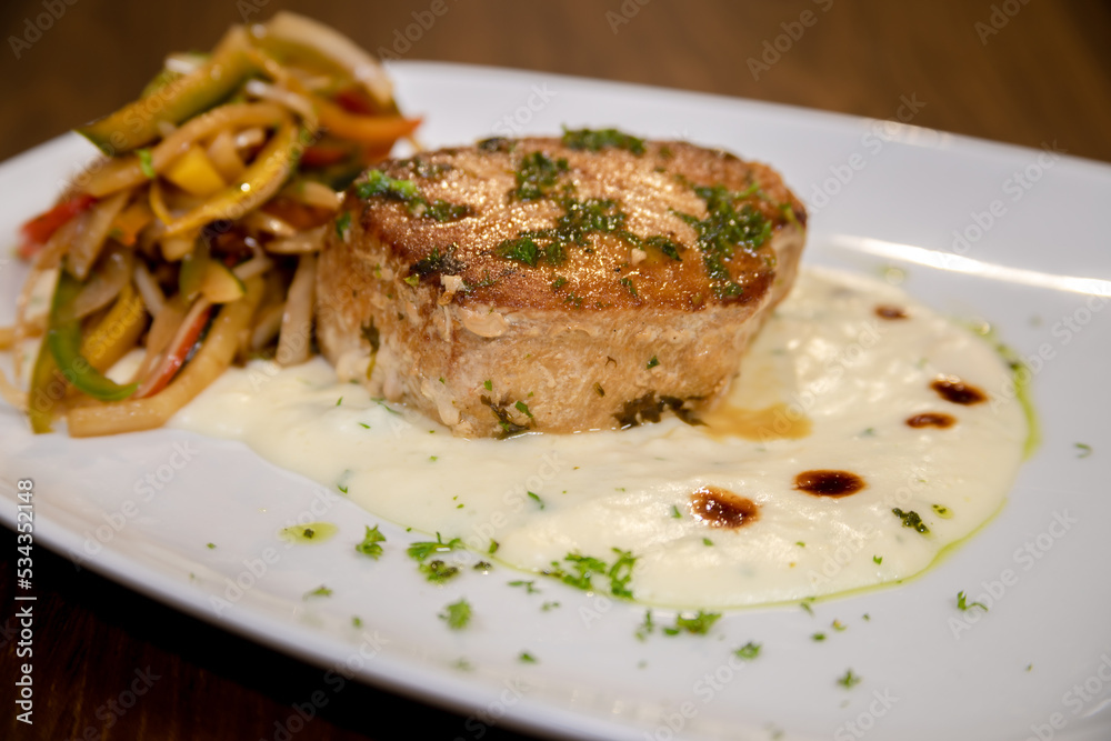 Typical colombian food and drinks, fish with steamed salad