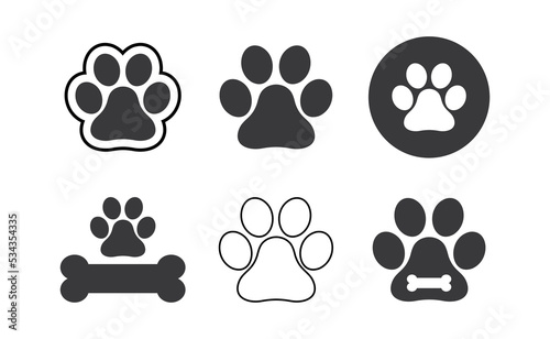 Dog paw prints set. Black silhouettes of paw icons. Vector isolated illustration