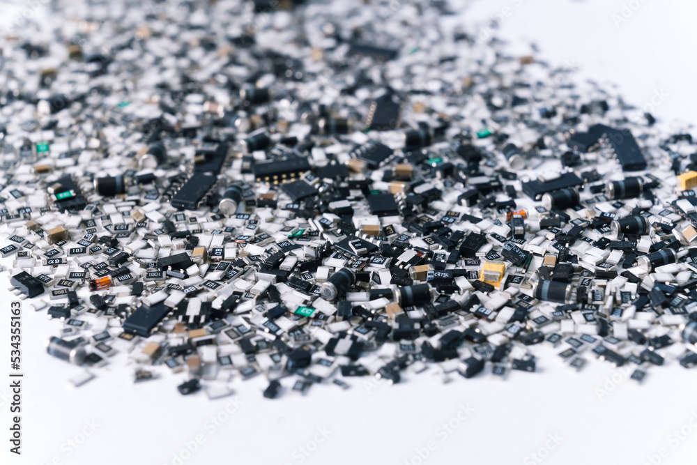 Scattered electronic parts and components of a circuit board. Modern technology. Manufacturing process. SMD. High quality photo Scattered electronic parts and components of a circuit board. Modern technology. Manufacturing process. SMD. High quality photo