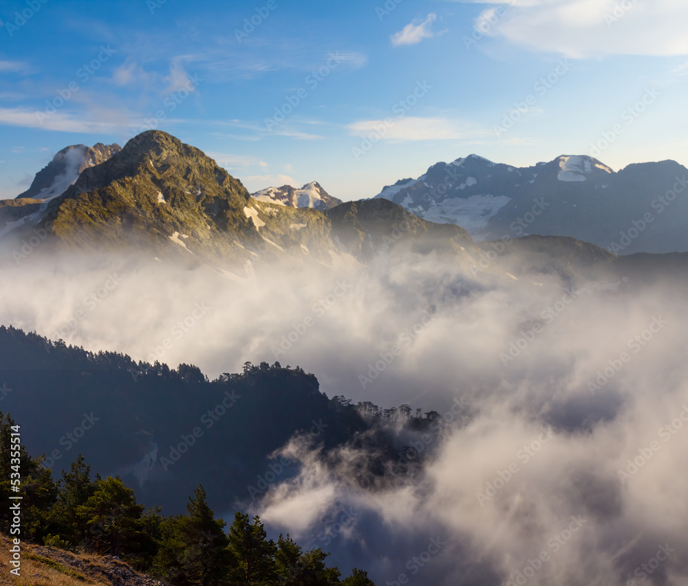 mountain valley in dense mist and clouds