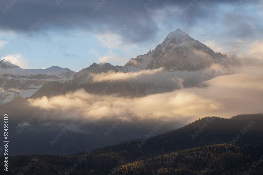 USA, Colorado, Uncompahgre National Forest. Sunrise on clouds below Mount Sneffels.