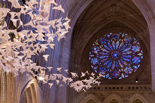 Usa, District of Columbia. Washington National Cathedral. Les Colombes is an exhibit that is made up of more than 2,000 white origami paper doves. It is the work of German artist, Michael Pendry. photo