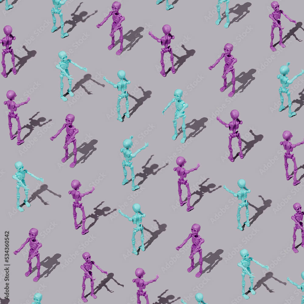 Pattern of colorful skeletons on a  pastel background. Spooky concept. Halloween or Santa Muerte idea.