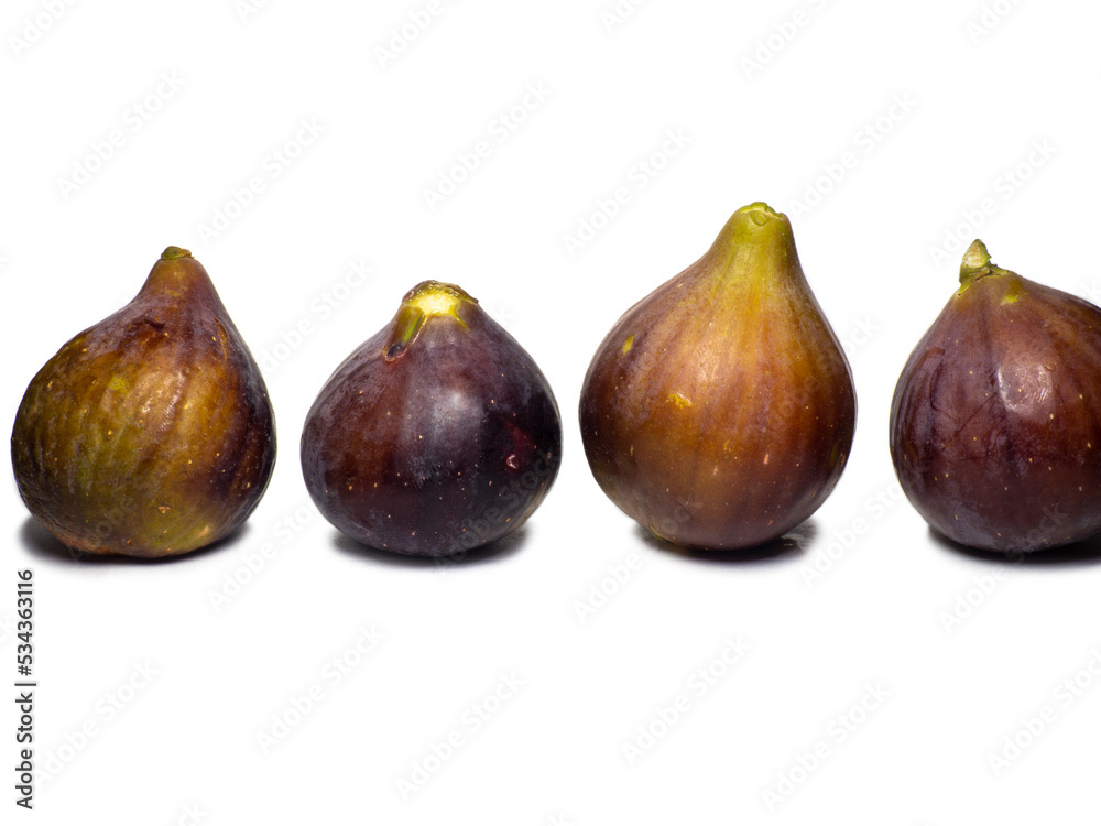 Ripe figs on a white background. Several figs. Southern fruit isolate. Purple fruit. Healthy diet. Ripe figs on a white background. Several figs. Southern fruit isolate. Purple fruit. Healthy diet.