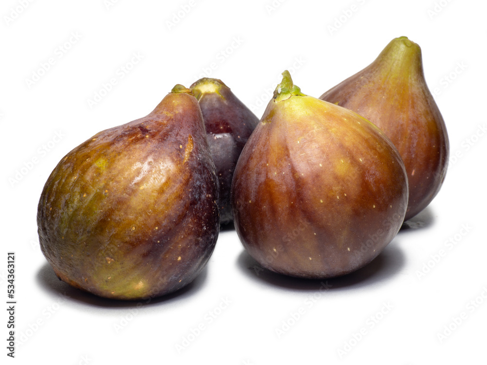 Ripe figs on a white background. Several figs. Southern fruit isolate. Purple fruit. Ripe figs on a white background. Several figs. Southern fruit isolate. Purple fruit.