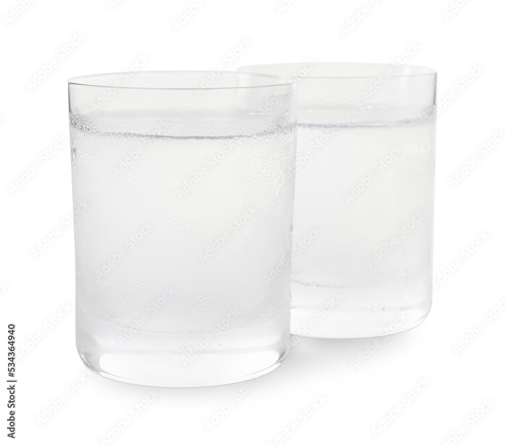 Vodka in shot glasses on white background Vodka in shot glasses on white background