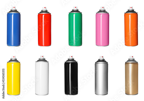 Set with colorful cans of spray paints on white background