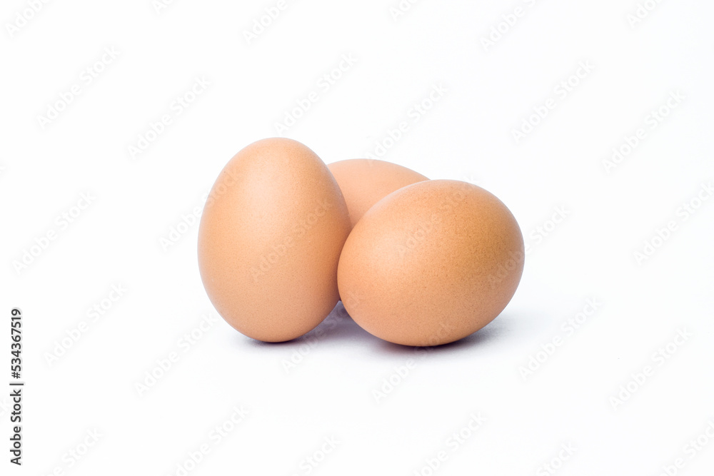 three chicken eggs on white background three chicken eggs on white background