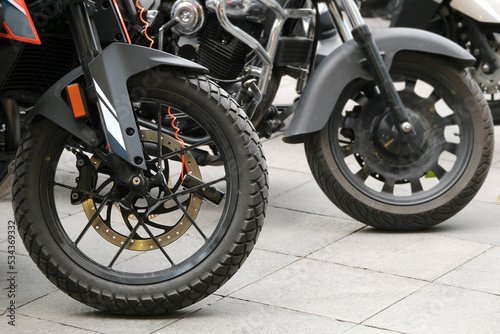 Close-up motorcycle wheels and a disc brake lock