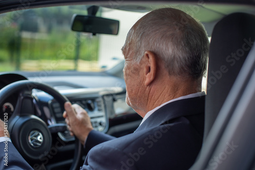 A senior man driving the car © mirza77