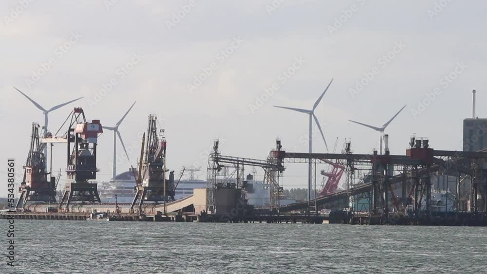 Looking across the water from the Hook of Holland towards factories and cranes etc. Netherlands. 2022 Looking across the water from the Hook of Holland towards factories and cranes etc. Netherlands. 2022
