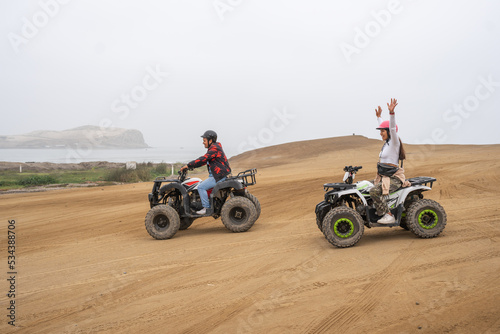 Friends on a free ride with quad bikes