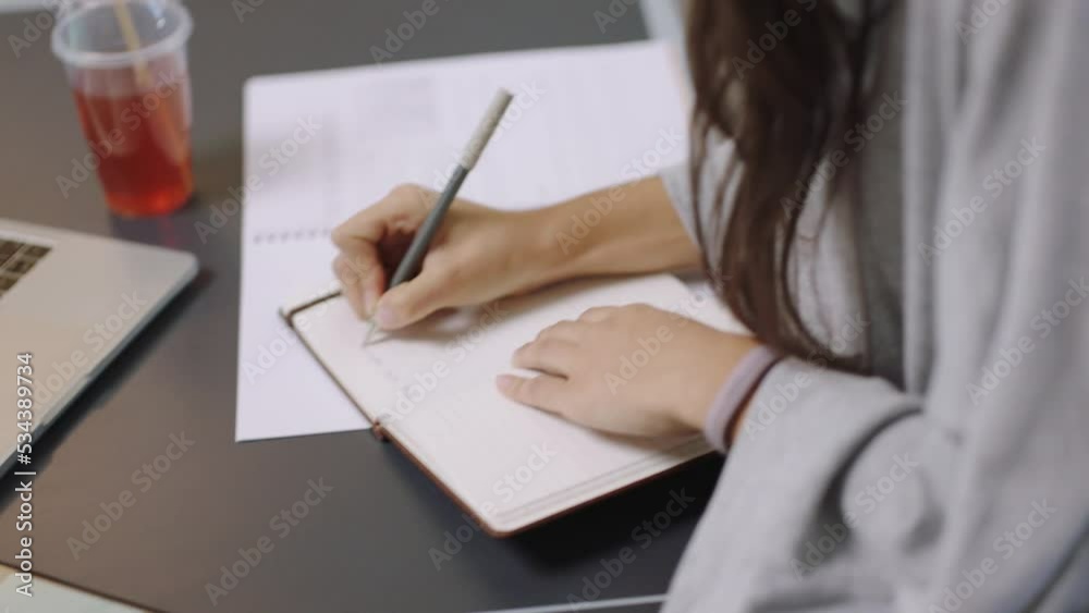 Writing, notes or design woman drinking tea with planning, schedule or listening to music, podcast or radio. Business, research or creative girl with marketing, SEO or advertising strategy idea Writing, notes or design woman drinking tea with planning, schedule or listening to music, podcast or radio. Business, research or creative girl with marketing, SEO or advertising strategy idea