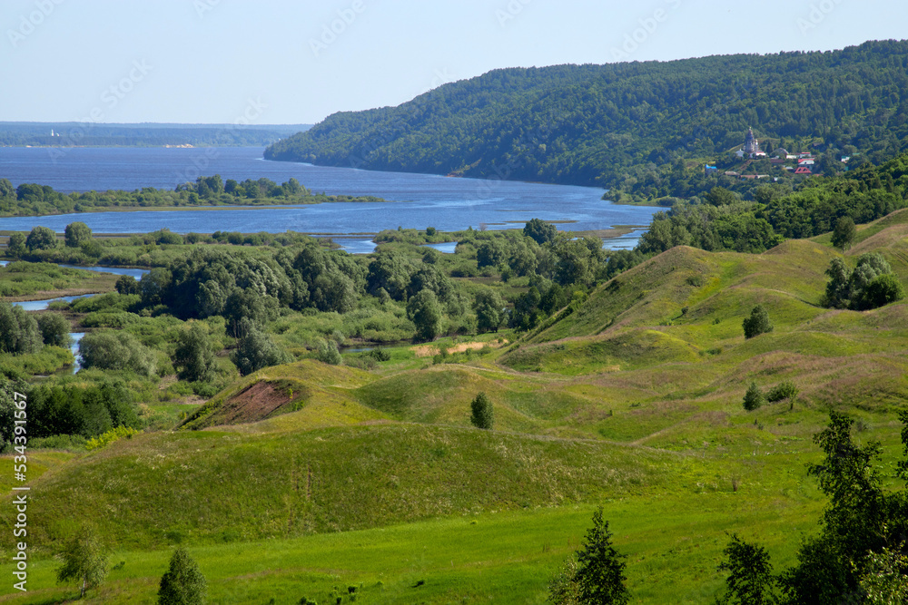 Sunny summer scene.Countryside landscape. River and lake. Russian landscape.