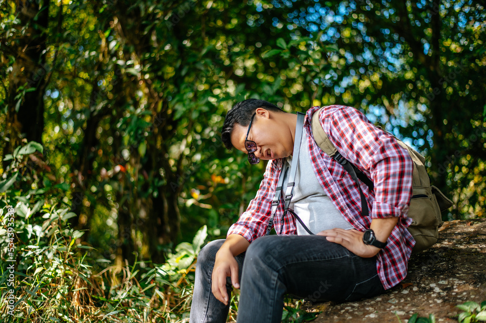 Young travel man relaxing after hiking and taking a break