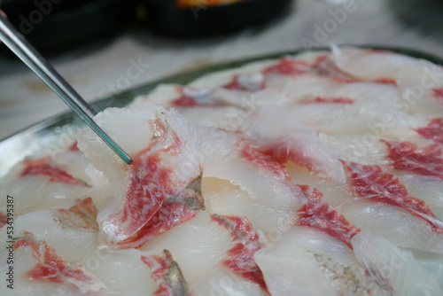 A plate full of fresh mullet sashimi