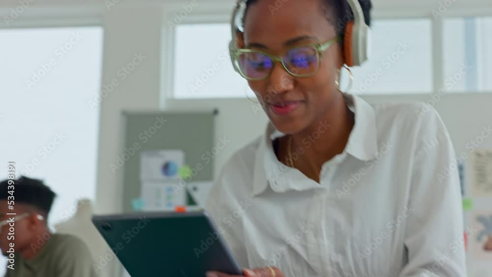 Woman, tablet and music in headphones, dance and working online in home or office. Black woman, mobile device and dancing while streaming song at work, happy and smile while doing job on the internet Woman, tablet and music in headphones, dance and working online in home or office. Black woman, mobile device and dancing while streaming song at work, happy and smile while doing job on the internet