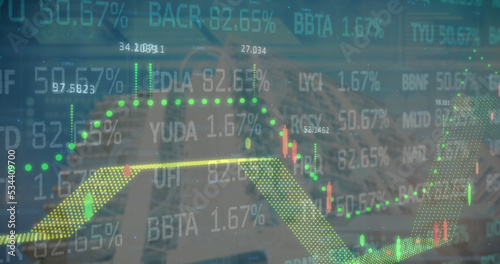 Financial and stock market data processing against tall buildings in background