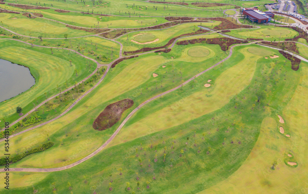 Aerial view of Golf Course Club and hotel resort. Green natural garden park in sport and recreation concept.