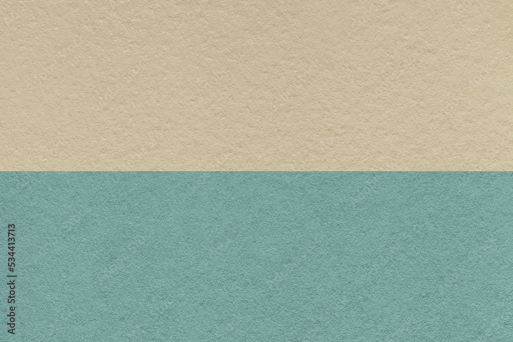 Texture of craft beige and blue paper background, half two colors. Vintage brown and cerulean cardboard. Texture of craft beige and blue paper background, half two colors. Vintage brown and cerulean cardboard.