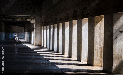 man in corridor in the old town