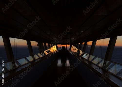 Bridge wing of ultra large container ship at sunset