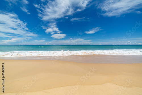 scenery white cloud in blue sky above long white beach..beautiful nature on the beach..smooth waves from green sea background.