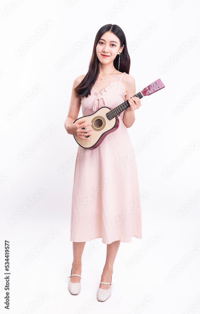The girl in the pink dress with the ukulele