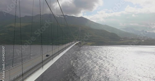 Cars traveling on cable stayed suspension Halogaland bridge in Narvik, Norway, aerial photo