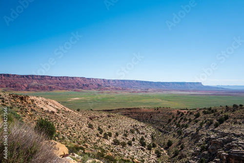 scenic view to the vermillion cliffs in sunlight and blue sky