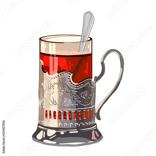Hot tea in a glass cup and a metal cup holder with a spoon. Symbol of traditional Russian tea drinking.