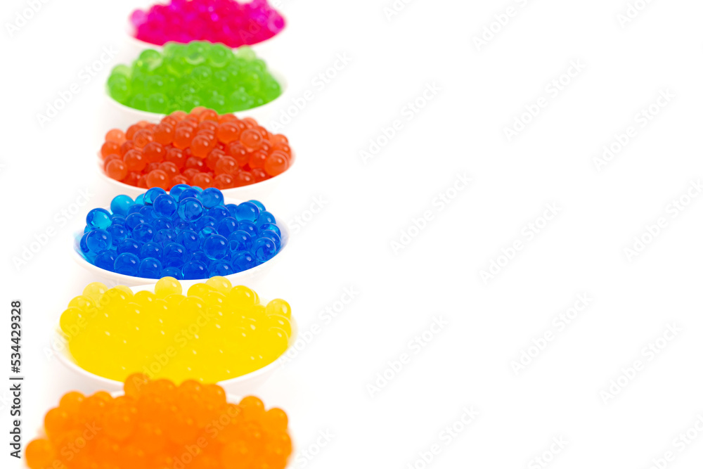 Six Different Flavors of Popping Boba Pearls on a White Background Six Different Flavors of Popping Boba Pearls on a White Background