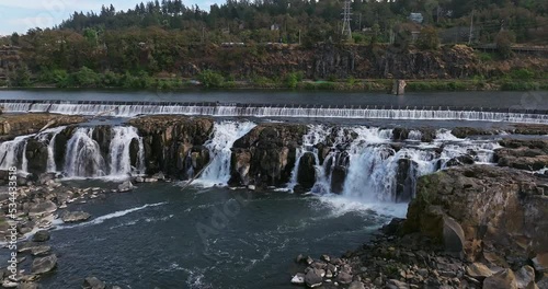 Willamette Falls Oregon City Oregon.   It is the largest waterfall in the Northwestern United States by volume, and the seventeenth widest in the world.  Horseshoe in shape, it is 1,500 feet wide.
