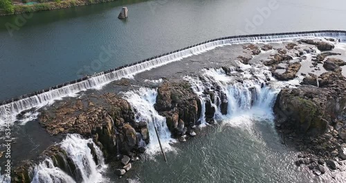 Willamette Falls Oregon City Oregon.   It is the largest waterfall in the Northwestern United States by volume, and the seventeenth widest in the world.  Horseshoe in shape, it is 1,500 feet wide.