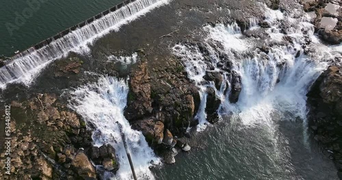 Willamette Falls Oregon City Oregon.   It is the largest waterfall in the Northwestern United States by volume, and the seventeenth widest in the world.  Horseshoe in shape, it is 1,500 feet wide.