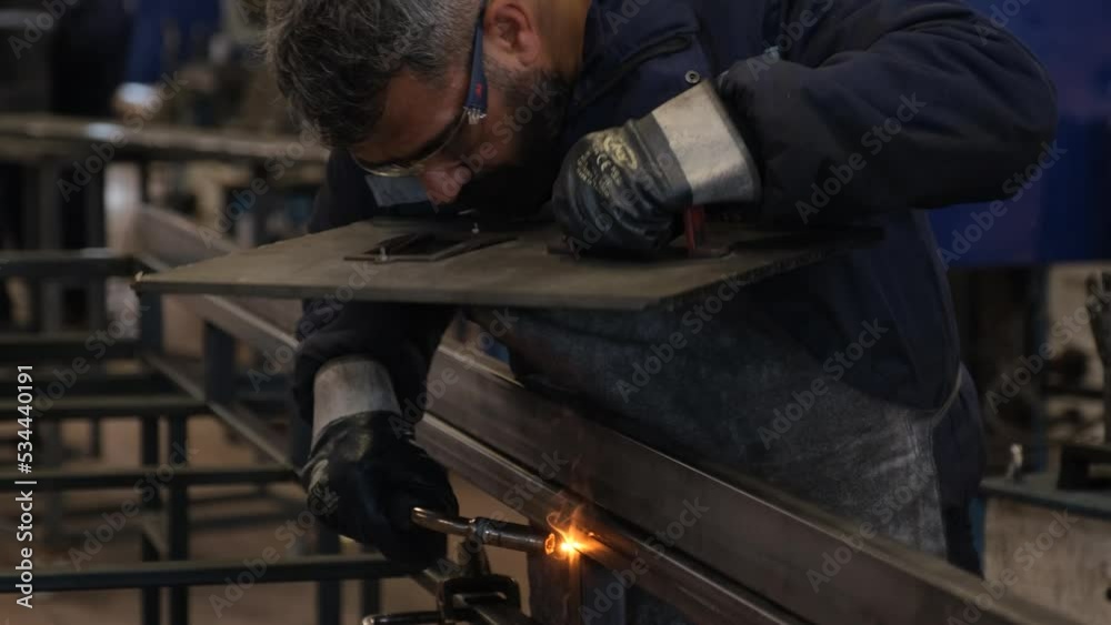 welder at work in factory