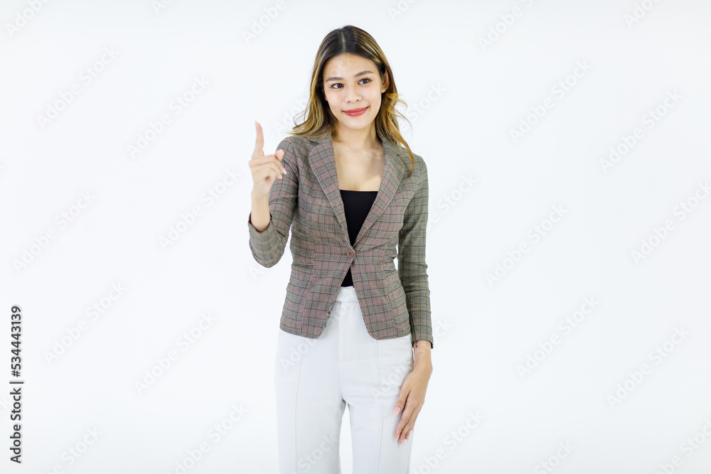 Isolated cutout studio shot of Millennial Asian successful professional female businesswoman in formal suit standing smiling holding hand pointing finger on blank empty space on white background Isolated cutout studio shot of Millennial Asian successful professional female businesswoman in formal suit standing smiling holding hand pointing finger on blank empty space on white background