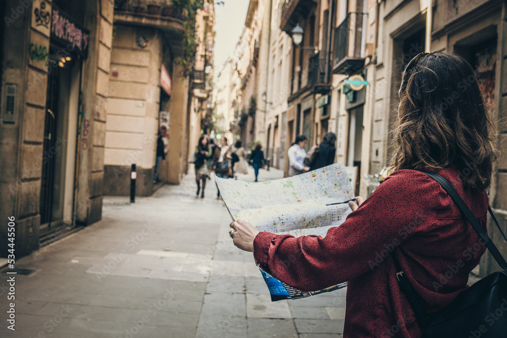 tourist woman with a map in Barcelona city street